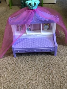 Barbie’s little sister Chelsea’s Purple Canopy Bed with Pink Tulle